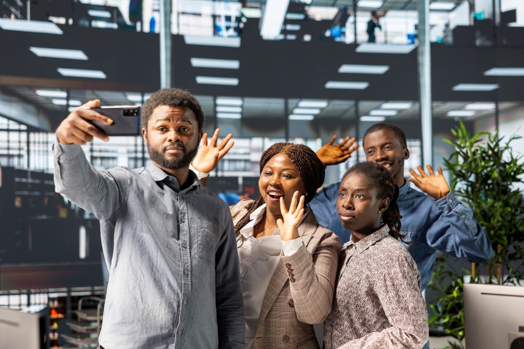 African American Coworkers Take Photos On Mobile P 2026 01 11 10 56 09 Utc